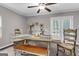 The dining room features a table, bench and chairs, along with doors leading to an outdoor area at 4481 Mclain Cir, Acworth, GA 30101