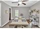 This large dining room has neutral paint, a window, and a long table at 4481 Mclain Cir, Acworth, GA 30101