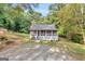 Charming single-story home with a inviting screened porch and lush green surroundings at 4481 Mclain Cir, Acworth, GA 30101