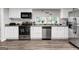 Bright kitchen features stainless steel appliances, updated cabinets, and plenty of counter space for meal preparation at 4481 Mclain Cir, Acworth, GA 30101