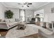 Stylish living room with hardwood floors and an open view into the adjacent, well-lit kitchen at 4481 Mclain Cir, Acworth, GA 30101