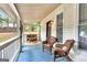 Inviting screened porch with wicker seating, offering a peaceful outdoor living space at 4481 Mclain Cir, Acworth, GA 30101
