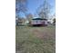 Exterior shot of backyard with deck and shed at 18 Laurel St, Covington, GA 30014