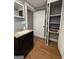 Bathroom showcasing a single sink vanity and access to the closet at 18 Laurel St, Covington, GA 30014