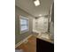 Updated bathroom with granite counters, vanity, tub, and shower combo at 18 Laurel St, Covington, GA 30014