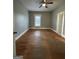Spacious bedroom featuring hardwood floors, neutral paint, and ample natural light at 18 Laurel St, Covington, GA 30014