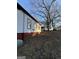 Angle view of home showcasing siding, large lot and backyard at 18 Laurel St, Covington, GA 30014
