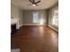 Living room showcasing hardwood floors, natural light, and classic fireplace, creating a bright and inviting atmosphere at 18 Laurel St, Covington, GA 30014