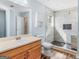 Bathroom features modern vanity, commode and shower over tub with decorative tile at 255 Brandon Ridge Cir, Stockbridge, GA 30281