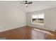 Bedroom featuring hardwood floors, neutral paint, ceiling fan, and a window at 255 Brandon Ridge Cir, Stockbridge, GA 30281