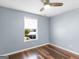 Bright bedroom featuring beautiful hardwood floors, and a window with natural light at 255 Brandon Ridge Cir, Stockbridge, GA 30281