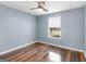 Bedroom with hardwood floors, a ceiling fan, and a window with a view of the outdoors at 255 Brandon Ridge Cir, Stockbridge, GA 30281