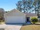 Charming single-story home featuring a two-car garage and well-maintained front lawn at 255 Brandon Ridge Cir, Stockbridge, GA 30281