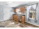 Kitchen featuring stainless steel appliances, wood cabinets, and updated floors at 255 Brandon Ridge Cir, Stockbridge, GA 30281