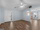 Bright living room featuring wood floors, ceiling fan, and open layout at 255 Brandon Ridge Cir, Stockbridge, GA 30281