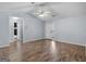 Spacious living area with hardwood floors, ceiling fan, and lots of natural light at 255 Brandon Ridge Cir, Stockbridge, GA 30281