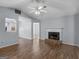 Cozy living room with fireplace, ceiling fan and wood-look flooring at 255 Brandon Ridge Cir, Stockbridge, GA 30281