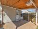 Covered patio area featuring access door and wood fence at 255 Brandon Ridge Cir, Stockbridge, GA 30281