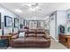 Finished basement featuring a large brown leather couch, storage, and rec space at 65 Ashland Grove Ct, Sharpsburg, GA 30277