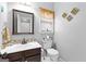Bathroom featuring a vanity with mosaic tile backsplash and a toilet at 65 Ashland Grove Ct, Sharpsburg, GA 30277