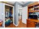 A well-organized closet with clothing and storage containers, complemented by hardwood floors at 65 Ashland Grove Ct, Sharpsburg, GA 30277
