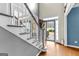 Foyer with staircase, hardwood floors, and lots of natural light at 65 Ashland Grove Ct, Sharpsburg, GA 30277