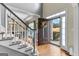 Foyer featuring an open door, staircase, hardwood floors, and natural light at 65 Ashland Grove Ct, Sharpsburg, GA 30277