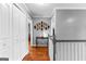 Hallway with hardwood floors, gray walls, and white trim presents a clean and modern aesthetic at 65 Ashland Grove Ct, Sharpsburg, GA 30277