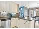 Elegant kitchen with stainless steel appliances, granite countertops, and stylish mosaic backsplash at 65 Ashland Grove Ct, Sharpsburg, GA 30277