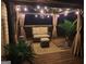 Inviting outdoor patio area with comfortable seating, elegant lighting, and stylish decor at 65 Ashland Grove Ct, Sharpsburg, GA 30277