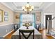 Dining room featuring a large window and elegant lighting at 65 Ashland Grove Ct, Sharpsburge, GA 30277