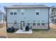 Exterior of home with windows, patio, and view of backyard at 340 Layfield Dr, Jonesboro, GA 30238