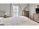 A bright bedroom features natural light, neutral walls, and classic furnishings at 340 Layfield Dr, Jonesboro, GA 30238