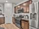 Modern kitchen with stainless steel appliances, dark wood cabinets, and ample counter space at 340 Layfield Dr, Jonesboro, GA 30238