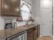 Well-lit kitchen with granite countertops, stainless steel appliances, and tile backsplash at 340 Layfield Dr, Jonesboro, GA 30238