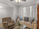 Inviting living room with a beige love seat, a brown recliner, and large windows at 340 Layfield Dr, Jonesboro, GA 30238