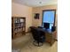 Functional home office space with a desk, bookshelf, and window at 5207 Sw West Shore Dr, Conyers, GA 30094