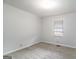 Cozy bedroom with neutral paint, carpet, and natural light from the window at 1436 Heritage Court Ct, Villa Rica, GA 30180