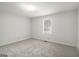 Carpeted bedroom featuring neutral paint and a single window, perfect for relaxation at 1436 Heritage Court Ct, Villa Rica, GA 30180