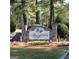 Stone entrance sign reading: Spurfield, nestled among trees and landscaping at 1436 Heritage Court Ct, Villa Rica, GA 30180