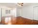 Spacious living room with hardwood floors, chandelier, and a large window at 1436 Heritage Court Ct, Villa Rica, GA 30180