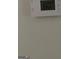 Close-up of a thermostat displaying a temperature of 60 degrees, wall mounted at 1436 Heritage Court Ct, Villa Rica, GA 30180