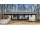 Charming single-story home with a black framed porch and a modern black roof at 1436 Heritage Ct, Villa Rica, GA 30180