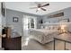 Comfortable bedroom with a full size bed, soft lighting, and natural light at 417 Plantain Ter, Peachtree City, GA 30269