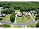 Stunning aerial view of a home with a private pool, expansive lawn, and lush green landscaping at 605 Clearwater Ct, Mcdonough, GA 30252