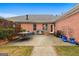 Backyard area with an outdoor dining set and brick exterior, ideal for relaxing and enjoying the outdoors at 605 Clearwater Ct, Mcdonough, GA 30252