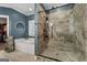 Bathroom featuring a bathtub, shelving and a marble tile shower with a glass enclosure at 605 Clearwater Ct, Mcdonough, GA 30252