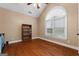 Spacious bedroom with hardwood floors, a large window, and ample natural light at 605 Clearwater Ct, Mcdonough, GA 30252