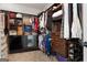 Walk-in closet with custom shelving and organization for clothes and accessories at 605 Clearwater Ct, Mcdonough, GA 30252