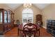 Elegant dining room with hardwood floors, a chandelier, and classic furniture at 605 Clearwater Ct, Mcdonough, GA 30252